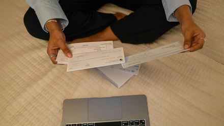 cheques in hand