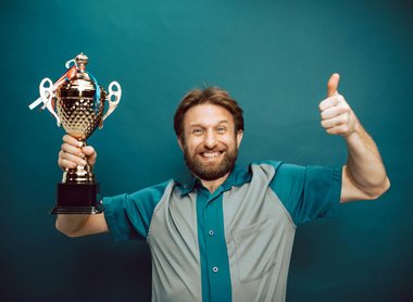 man holding trophy